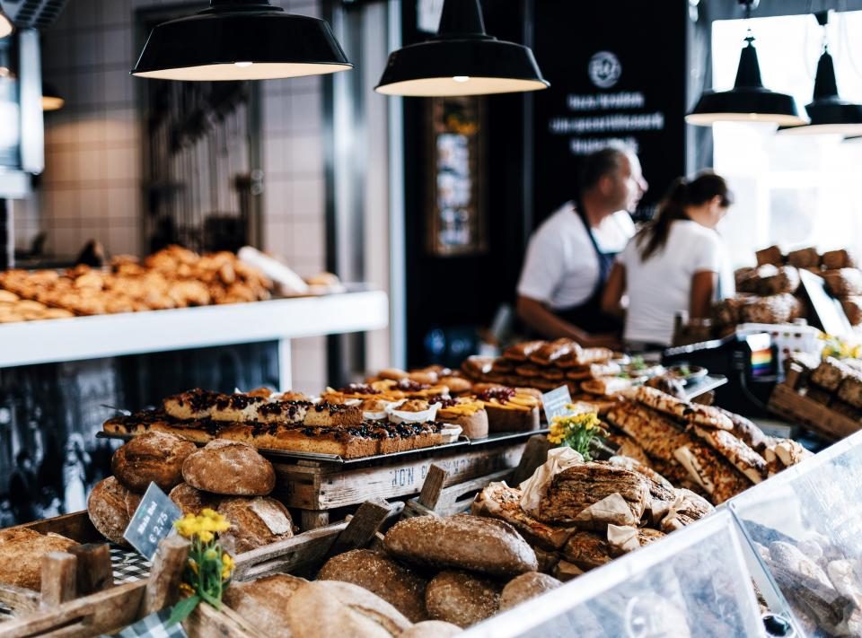 A counter of freshly baked bread and pastries