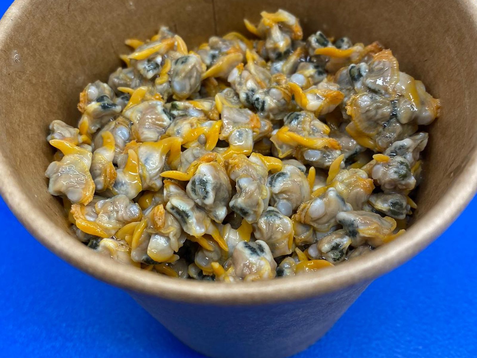 A tub of freshly cooked Penclawdd cockles